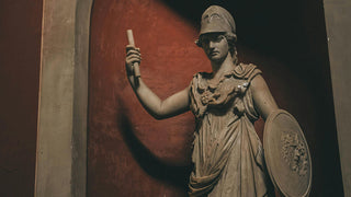 A bust of the Greek Goddess of Wisdom Pallas Minerva framed in a golden light of pastel colors