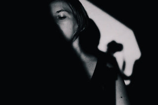 Silhouette of woman in shadow - Starting Shadow Work Journey