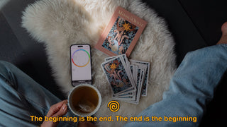 An astrology chart is open on a smartphone beside the cards. The caption reads: ‘Meet me at the Cosmic Corridor at the Beginning & End of time.’”
