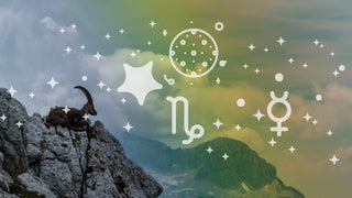 Goat chilling in the mountains rainbow horizon with alchemical symbols representing Mercury and Capricorn