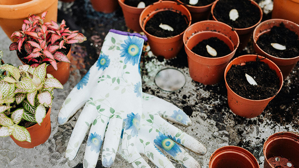 Pictured here are gardening gloves adorned with the serene blues and greens of the Earth, symbolizing Pisces' connection to the intuitive and fluid aspects of life. 