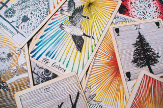 Scattered colorful tarot cards.